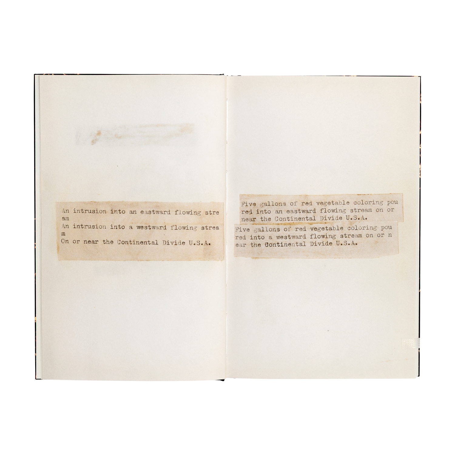 A two-page spread featuring the phrase “An intrusion into an eastward flowing stream. An intrusion into a westward flowing stream. On or near the Continental Divide U.S.A.” on the left page, and “Five gallons of red vegetable coloring poured into an eastward flowing stream on or near the Continental Divide U.S.A. Five gallons of red vegetable coloring poured into a westward flowing stream on or near the Continental Divide U.S.A.” on the right page.
